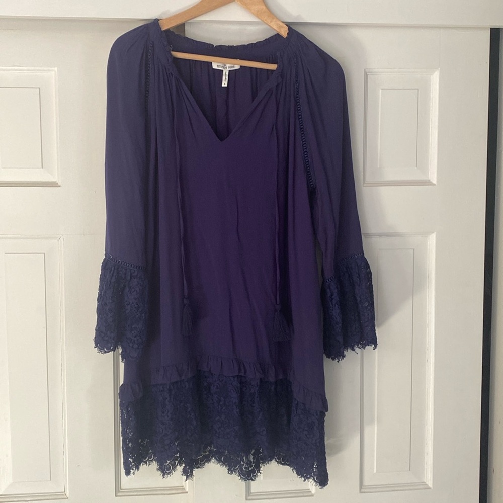 Navy blue knee length loose fitting dress with lace detail on sleeves and hem.